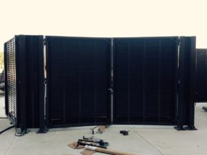 A screen system with fire code compliant screen doors