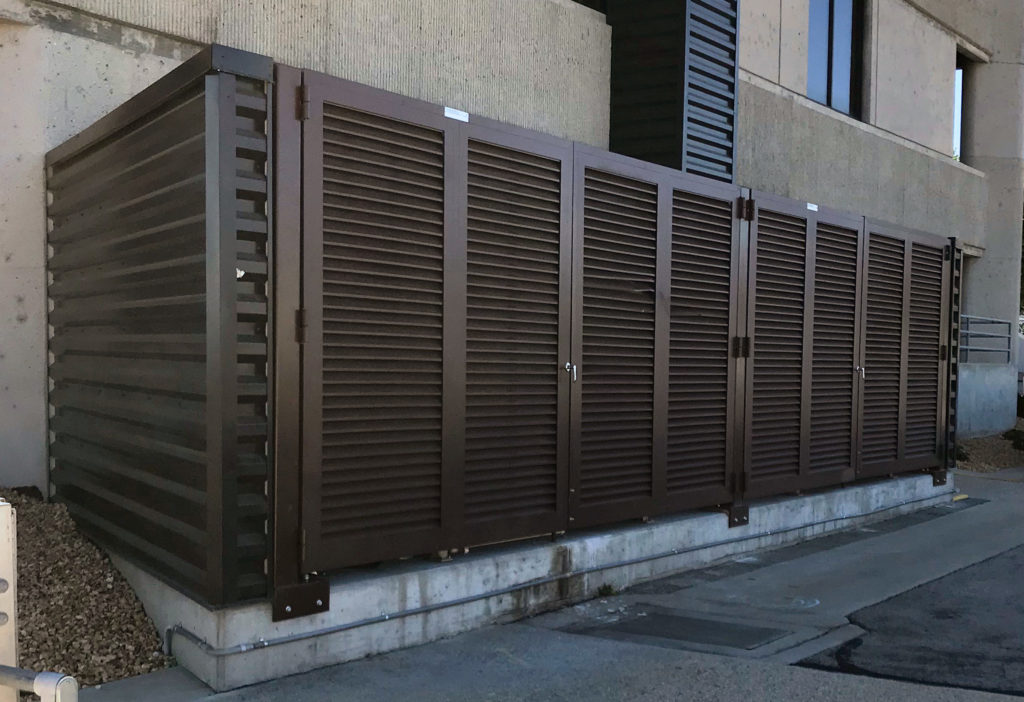 PalmSHIELD Louvers. Steel vertical louver screen system. architectural mechanical screening screen louvered semi private private solid staggered board on board shadow box alternating ametco barnett and bates industrial louvers rooftop louvers beta orsogrill omega chillers generators truck wells outside storage condensers rooftop equipment patios trash dumpsters transformers HVAC courtyards pool equipment fence aluminum galvanized steel degree of openness direct visibility standalone wall louvers