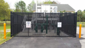 Mechanical equipment screened by chain link with privacy slats