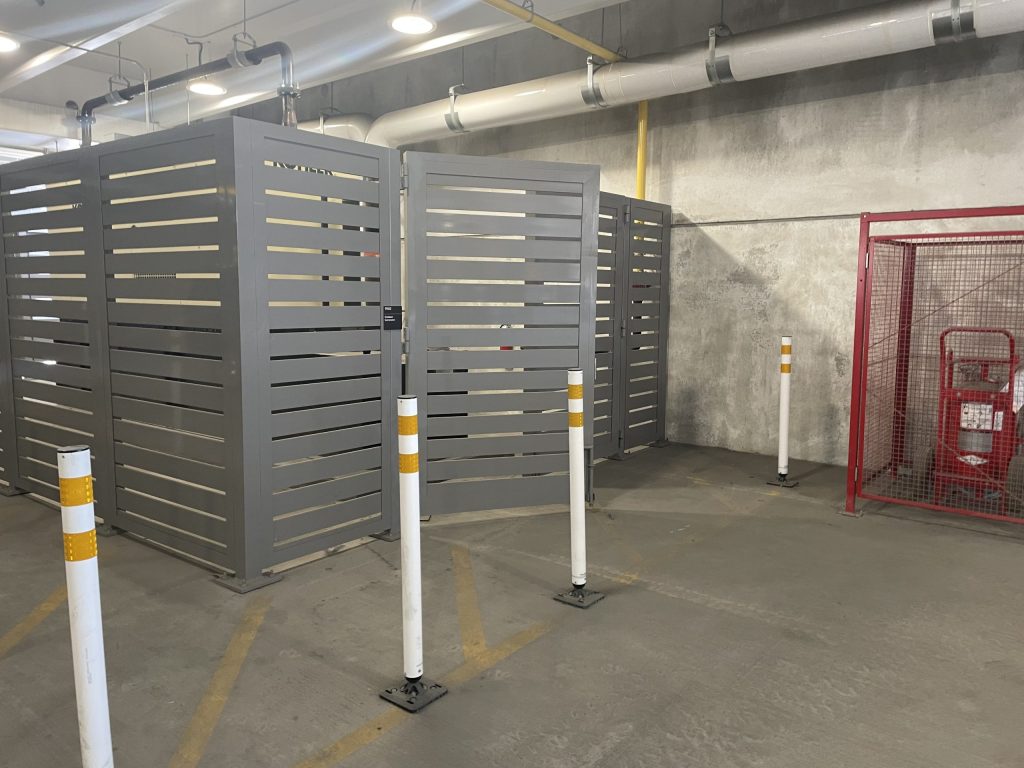 Interior mechanical equipment screen enclosure surrounded by bollards.