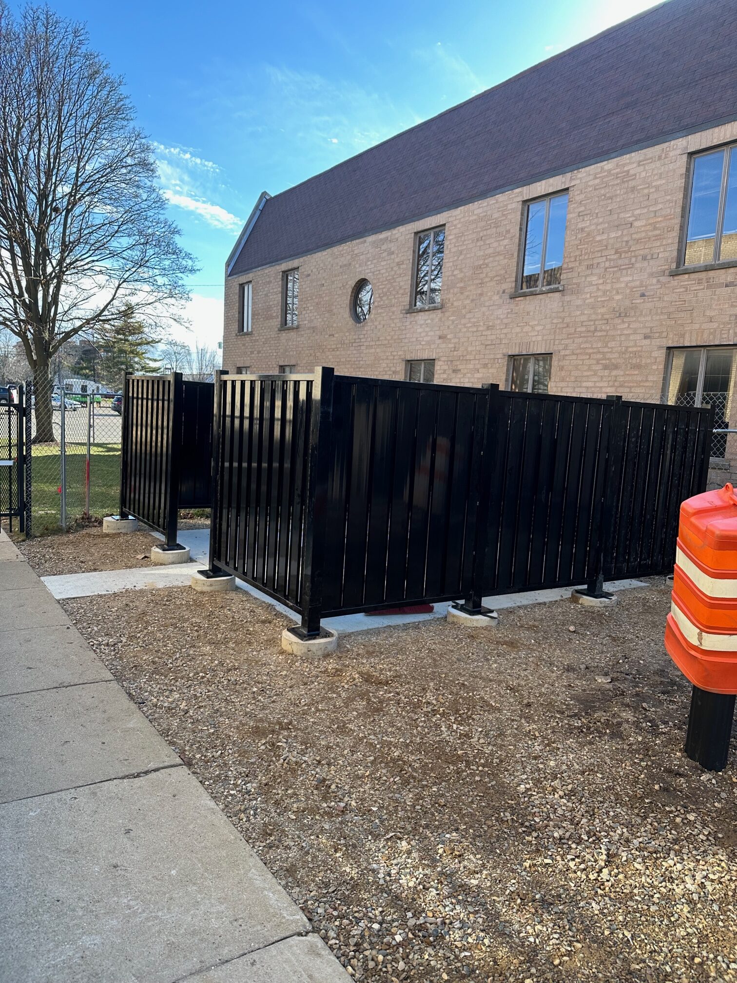 A Kalamazoo, Michigan building with black architectural screening in its front entrance.